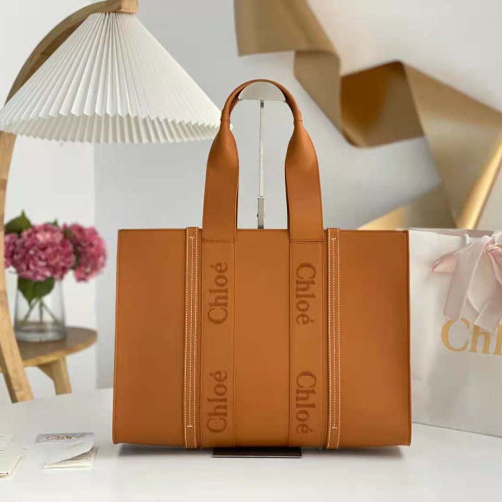 Close-up of polished gold hardware on Chloe Women Large Woody Tote Bag-Brown