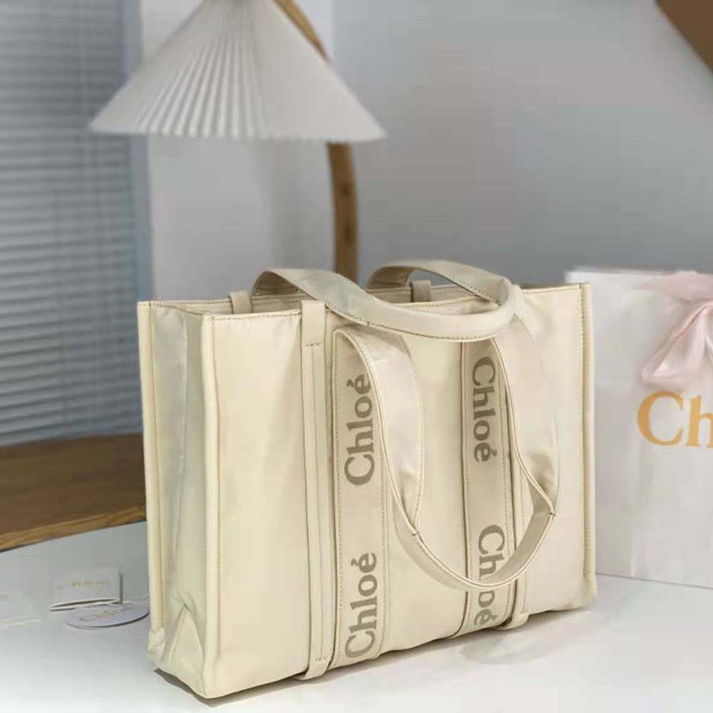 Side view highlighting gold hardware on Chloe Women Large Woody Tote Bag-White