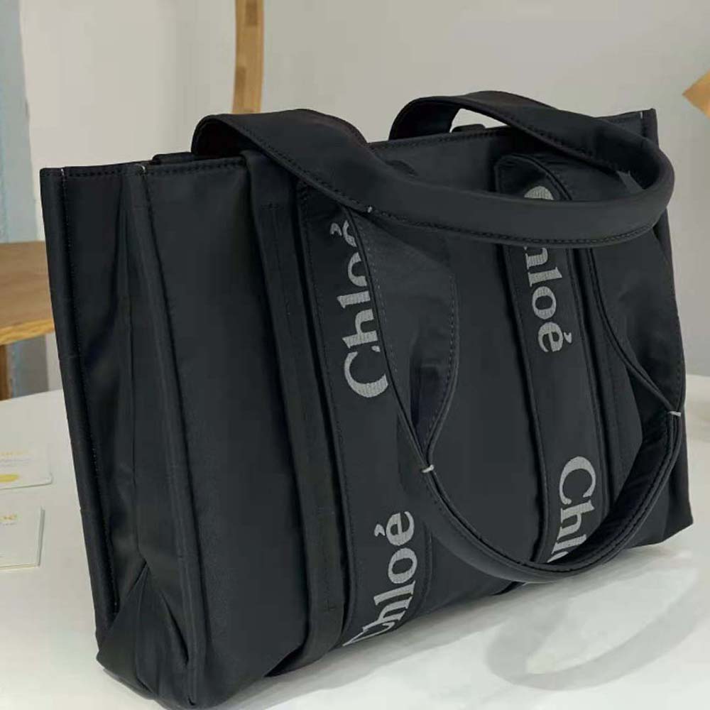 Interior view of Chloe Women Medium Woody Tote Bag-Black with suede lining