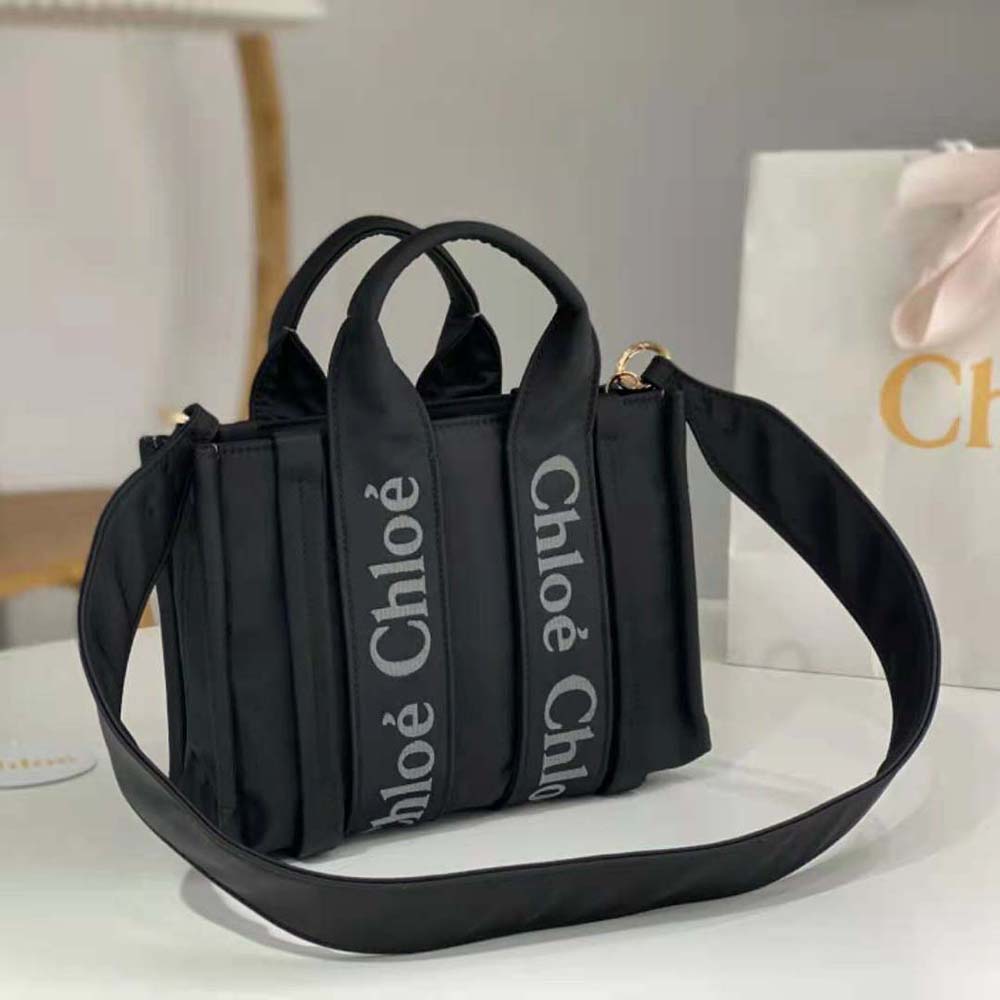 Side angle highlighting structured silhouette of Chloe Women Small Woody Tote Bag-Black