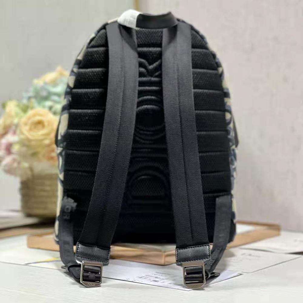 Side angle showing silver-tone hardware on Dior Men Rider Backpack