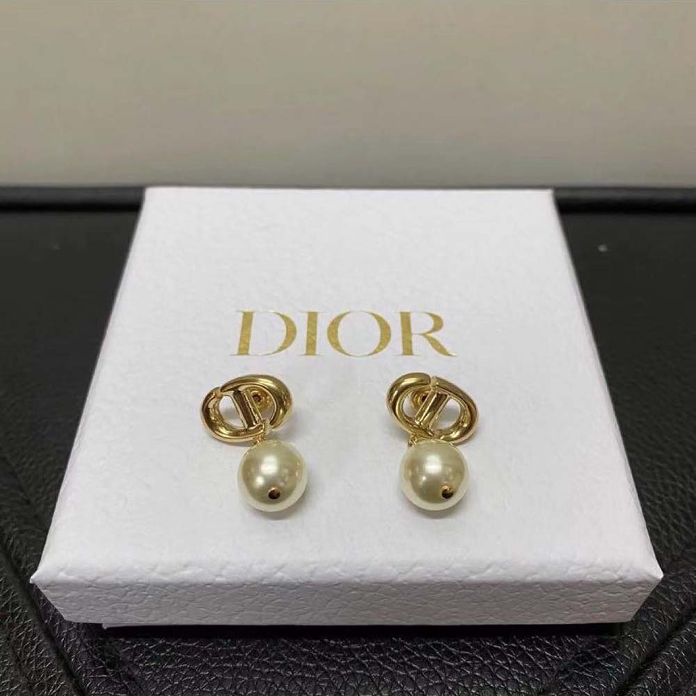 Side angle showing clip closure of Dior Women CD Navy Earrings with pearls