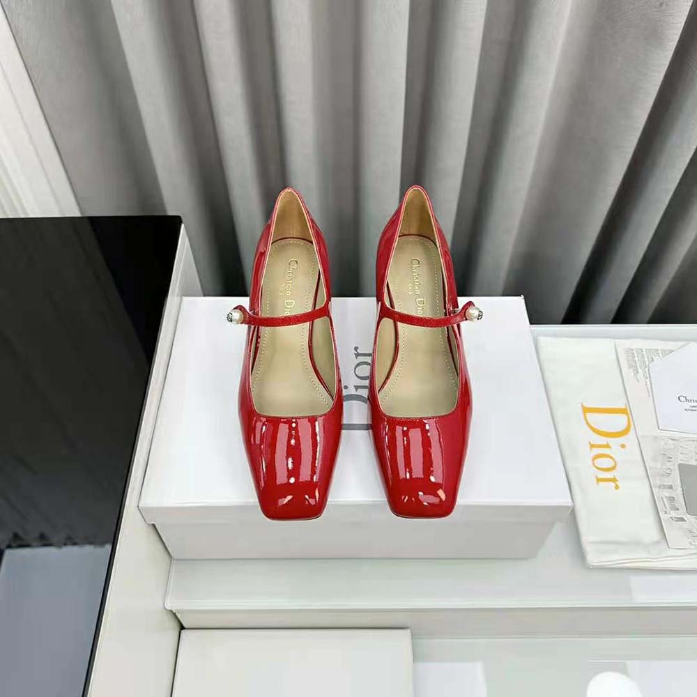 Close-up on glossy red patent calfskin and signature Dior stitching