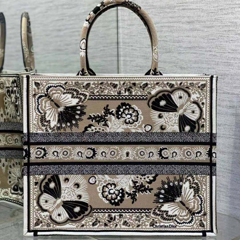 Side angle showing silhouette and silver hardware on Dior Women Large Dior Book Tote