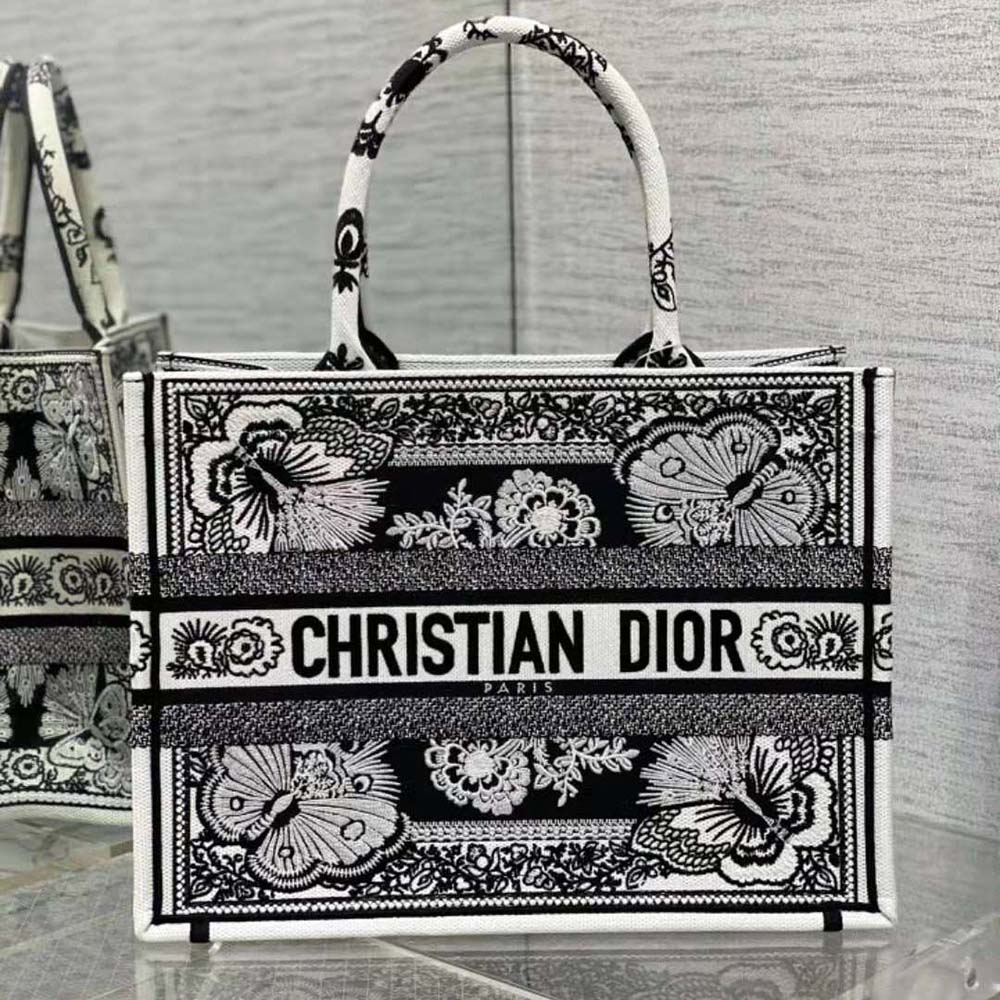 Close-up detail of black and white butterfly bandana embroidery on Dior tote