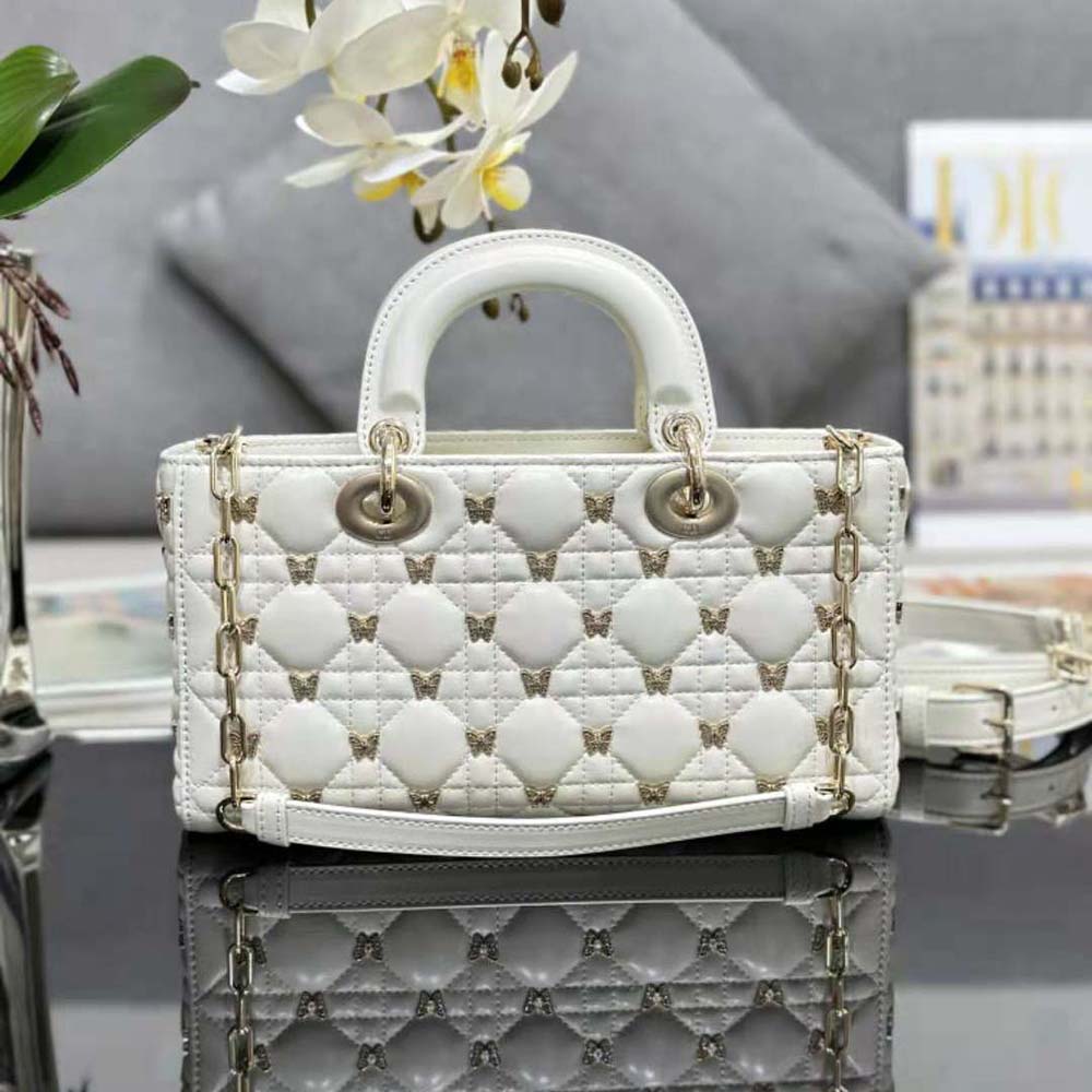 Side view showing structured silhouette of Dior Women Medium Lady D-joy Bag in white