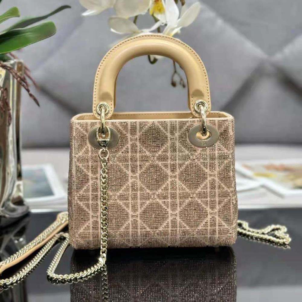 Side angle showing silhouette and flap closure of Dior Mini Lady D-joy Bag