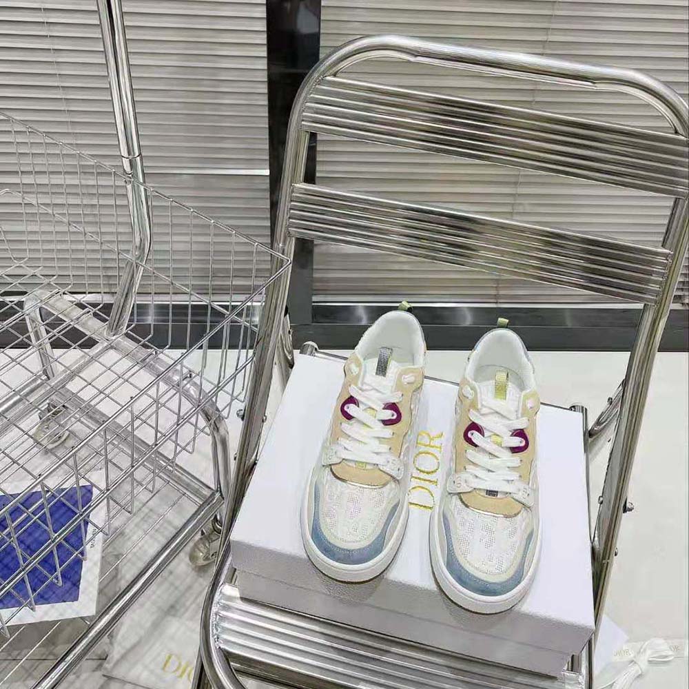 Close-up of perforated white calfskin and multicolor suede on Dior Women One Sneaker
