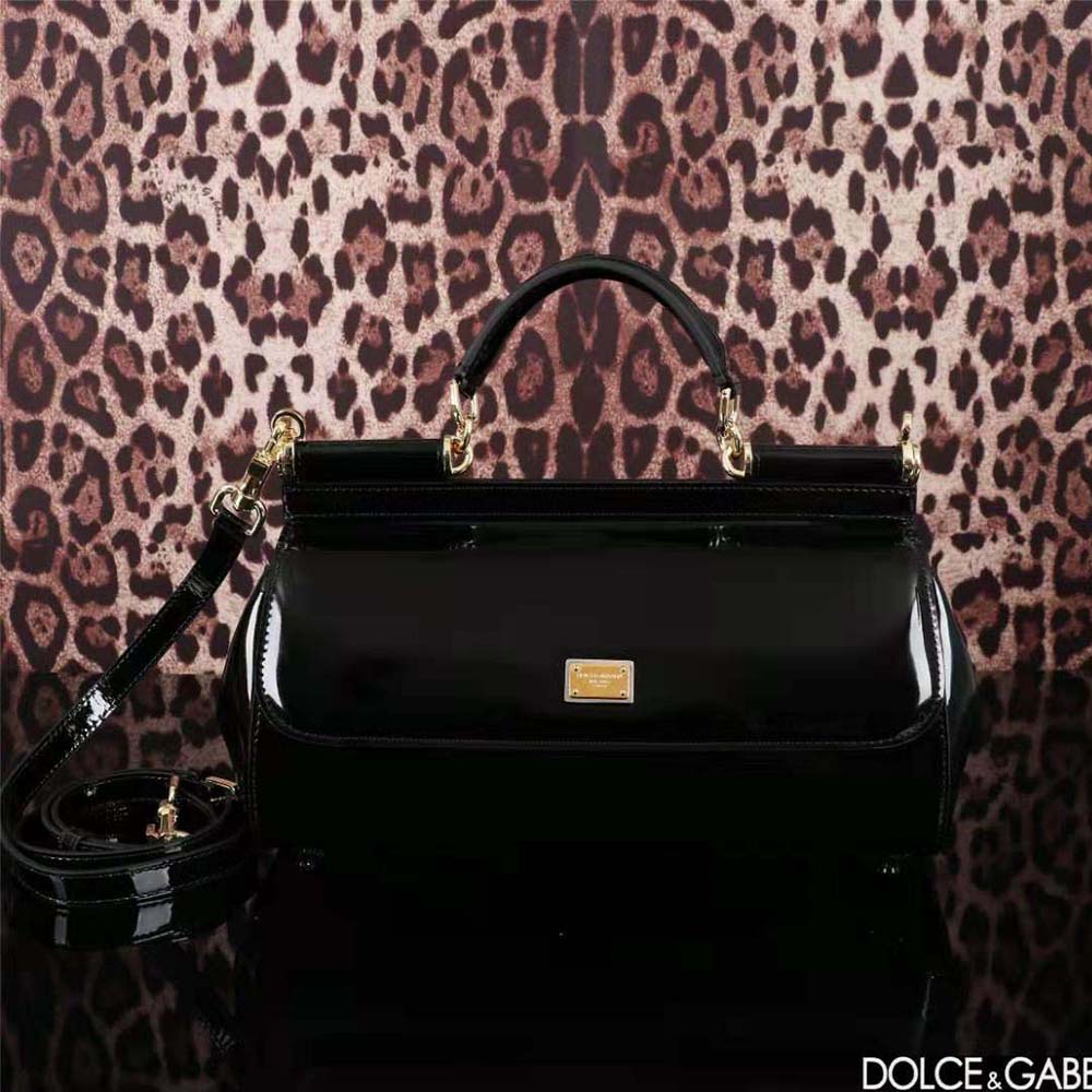 Close-up of gold D&G logo hardware on elongated Sicily handbag