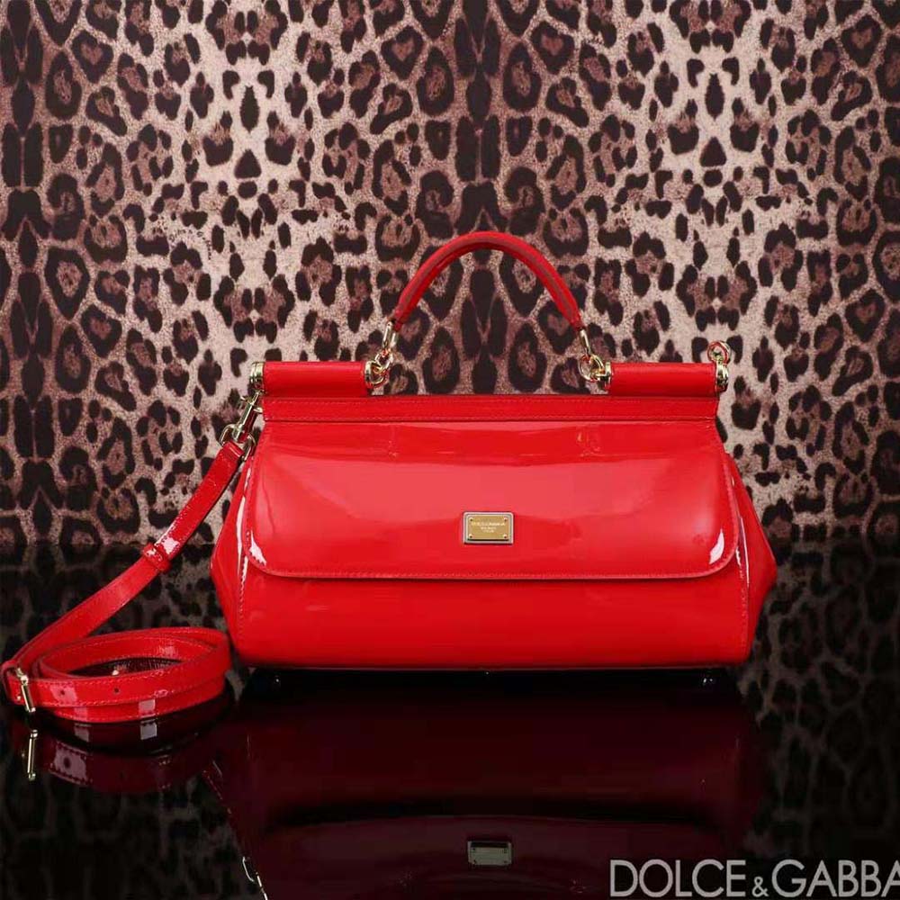 Close-up of gold D&G logo hardware on handbag flap
