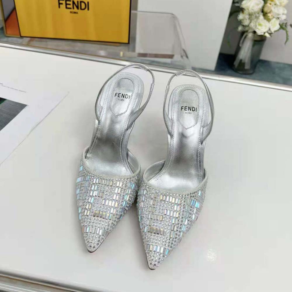 Close-up detail of rhinestone embellishments on Fendi First Silver-colored slingbacks