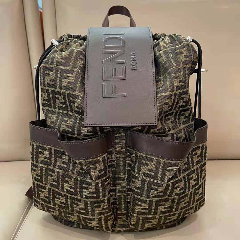 Close-up of gold-tone hardware on Fendi Men Strike Large FF Jacquard Fabric Backpack-Brown