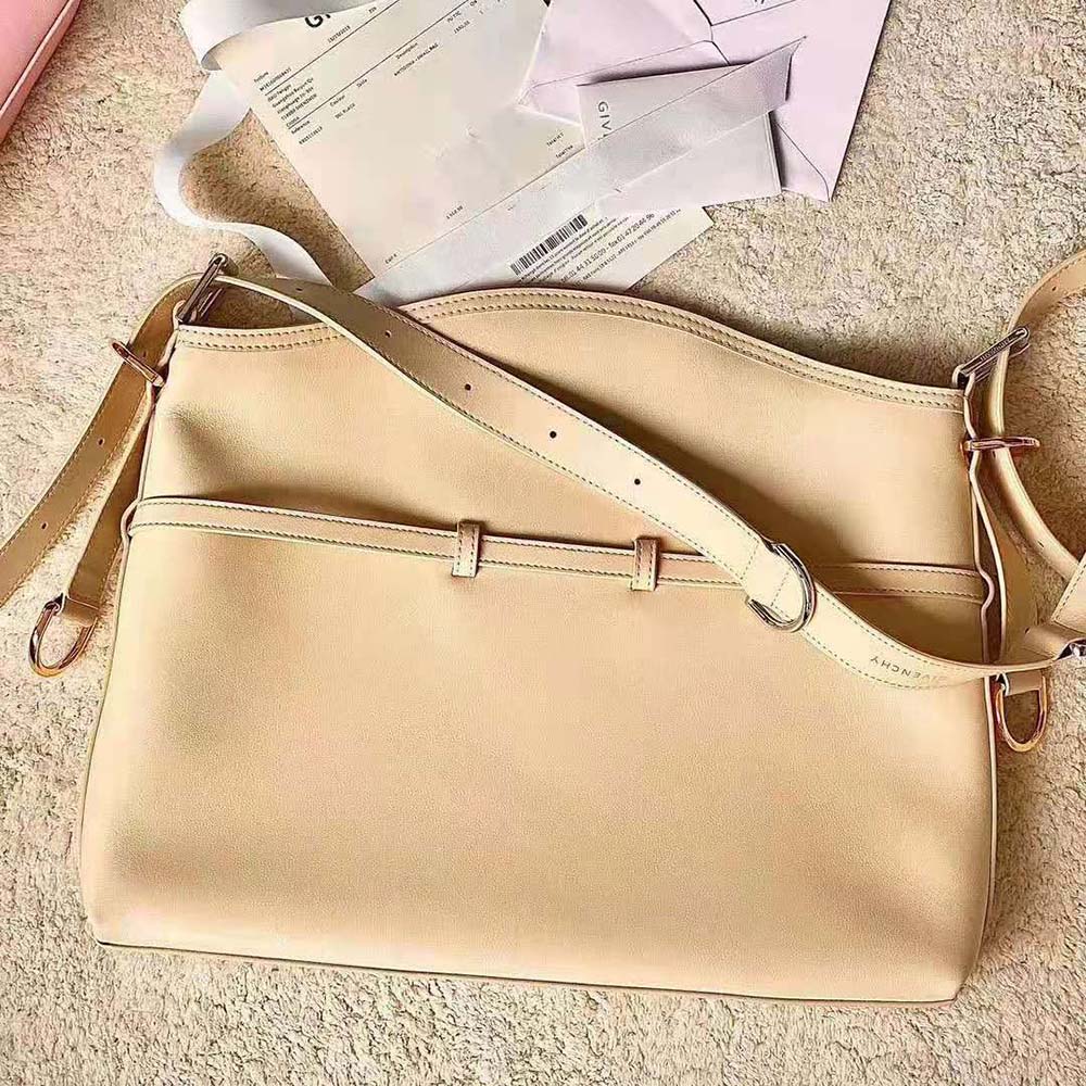 Side view showing medium silhouette and shoulder strap of Givenchy Women Medium Voyou Bag