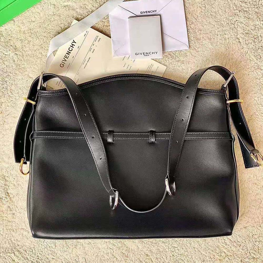 Side angle showing smooth black leather and magnetic flap closure