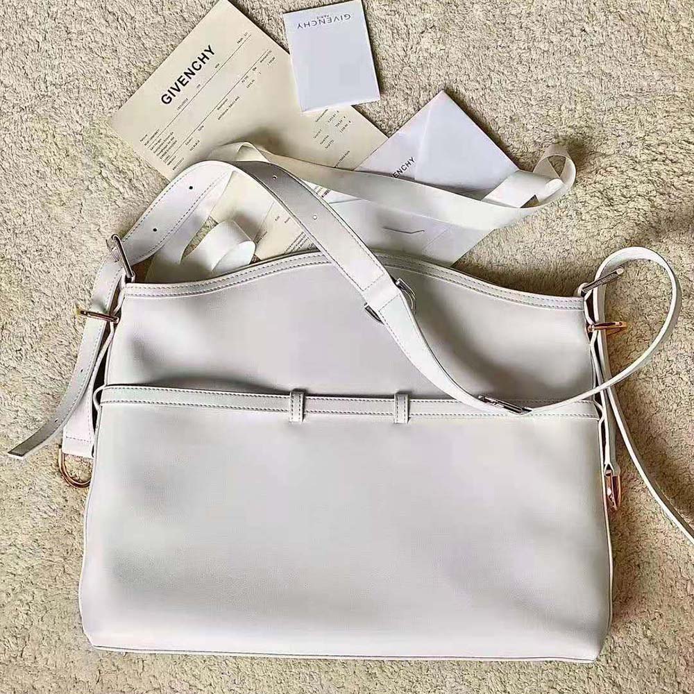 Side profile showing smooth leather texture of Givenchy Women Medium Voyou Bag
