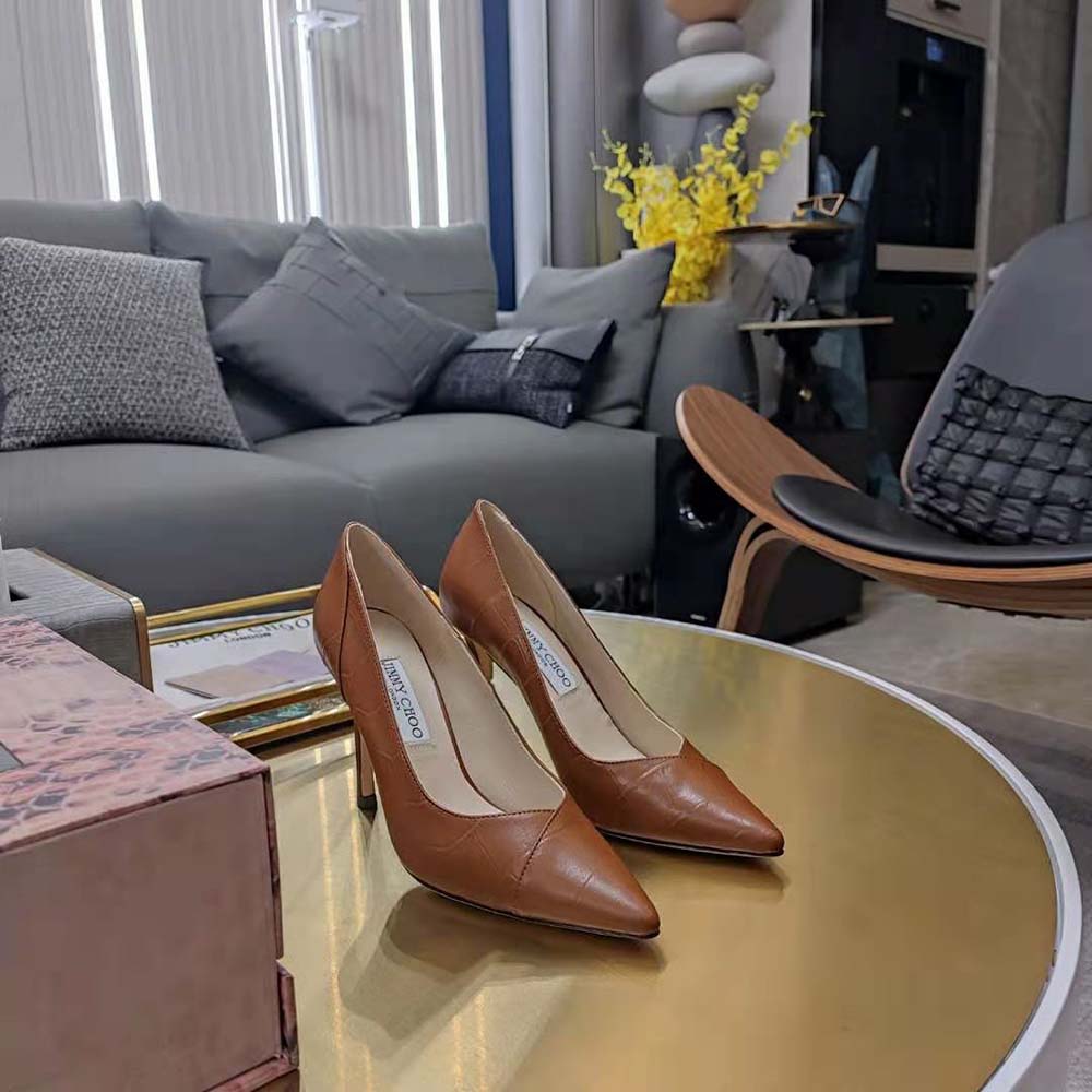 View of heel and gold-tone plaque on Jimmy Choo Cass 95 leather pumps