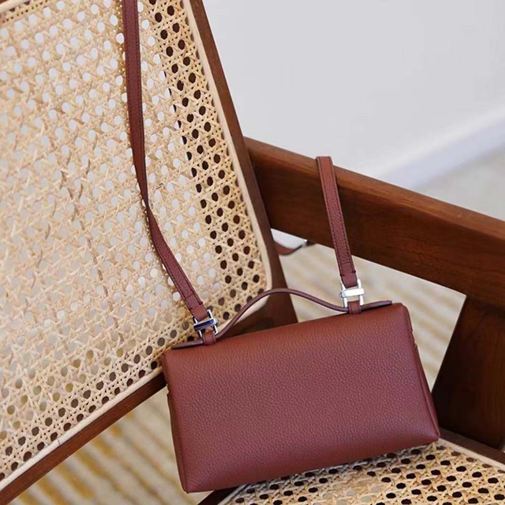 Side angle showing compact silhouette of Loro Piana Women Extra Pocket Pouch L19