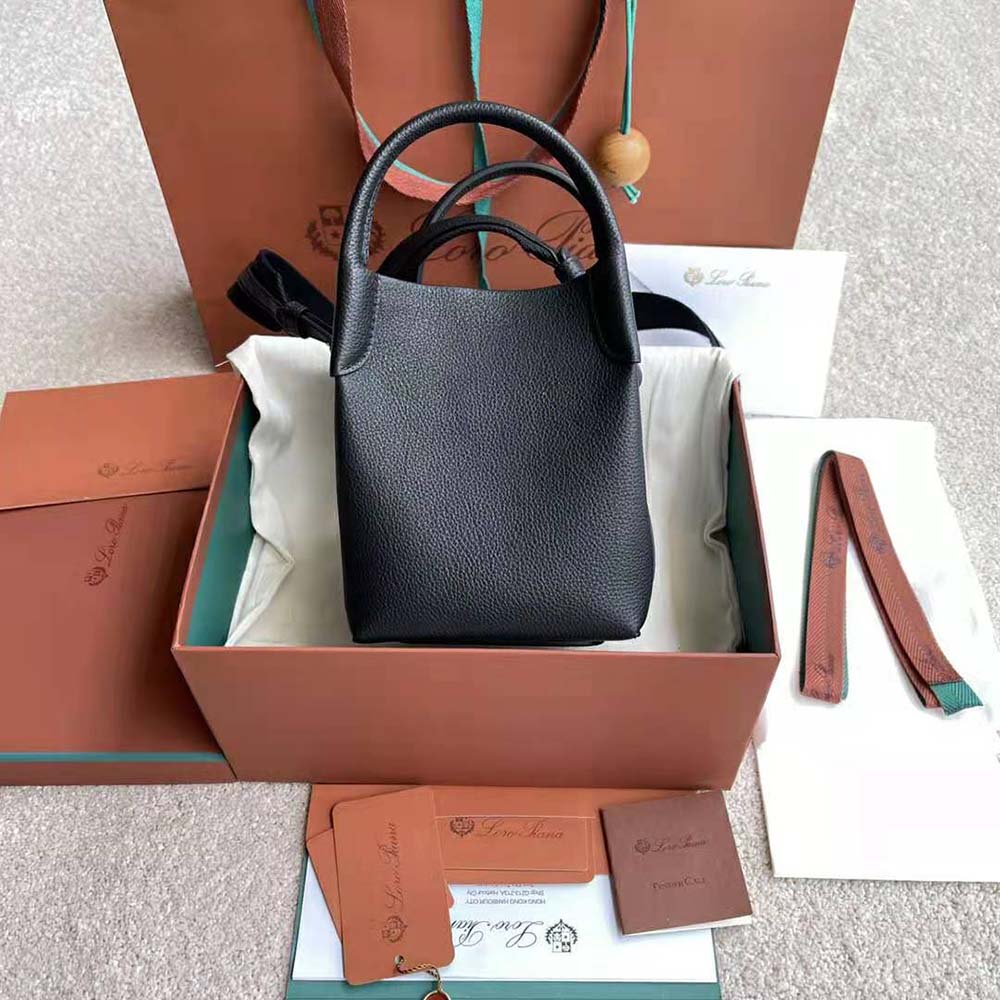 Side angle showing zip closure and tonal hardware on Loro Piana Micro Bale Bag