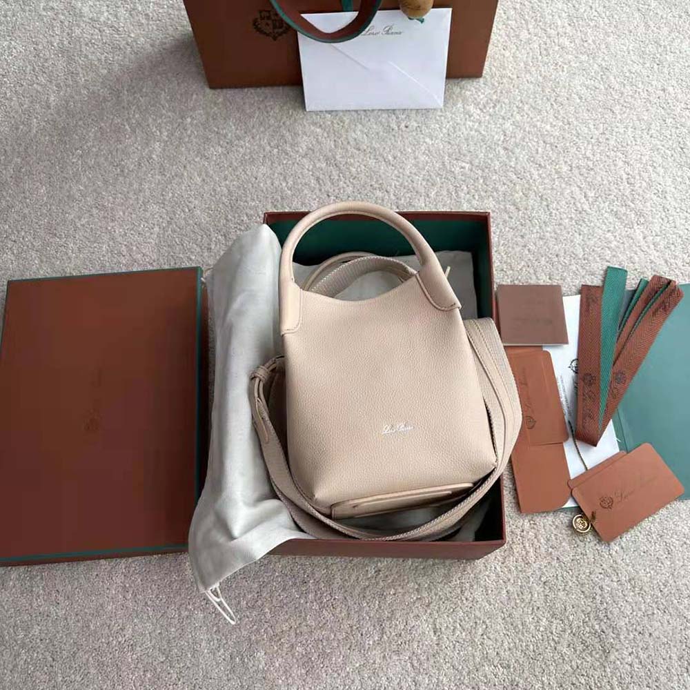 Close-up of gold hardware and pink leather on Loro Piana Micro Bale Bag