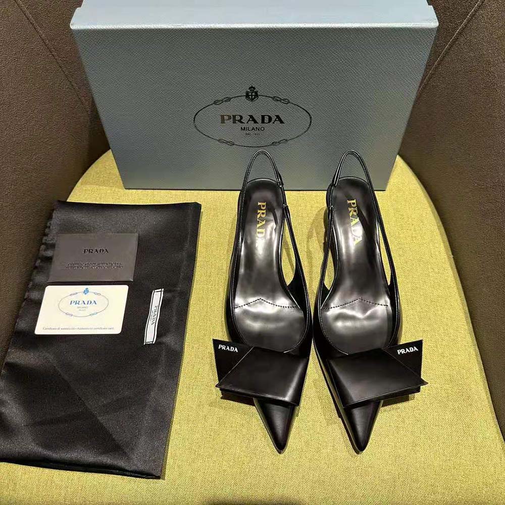 Close-up of silver buckle detail on Prada Women Brushed Leather Slingback Pumps-Black