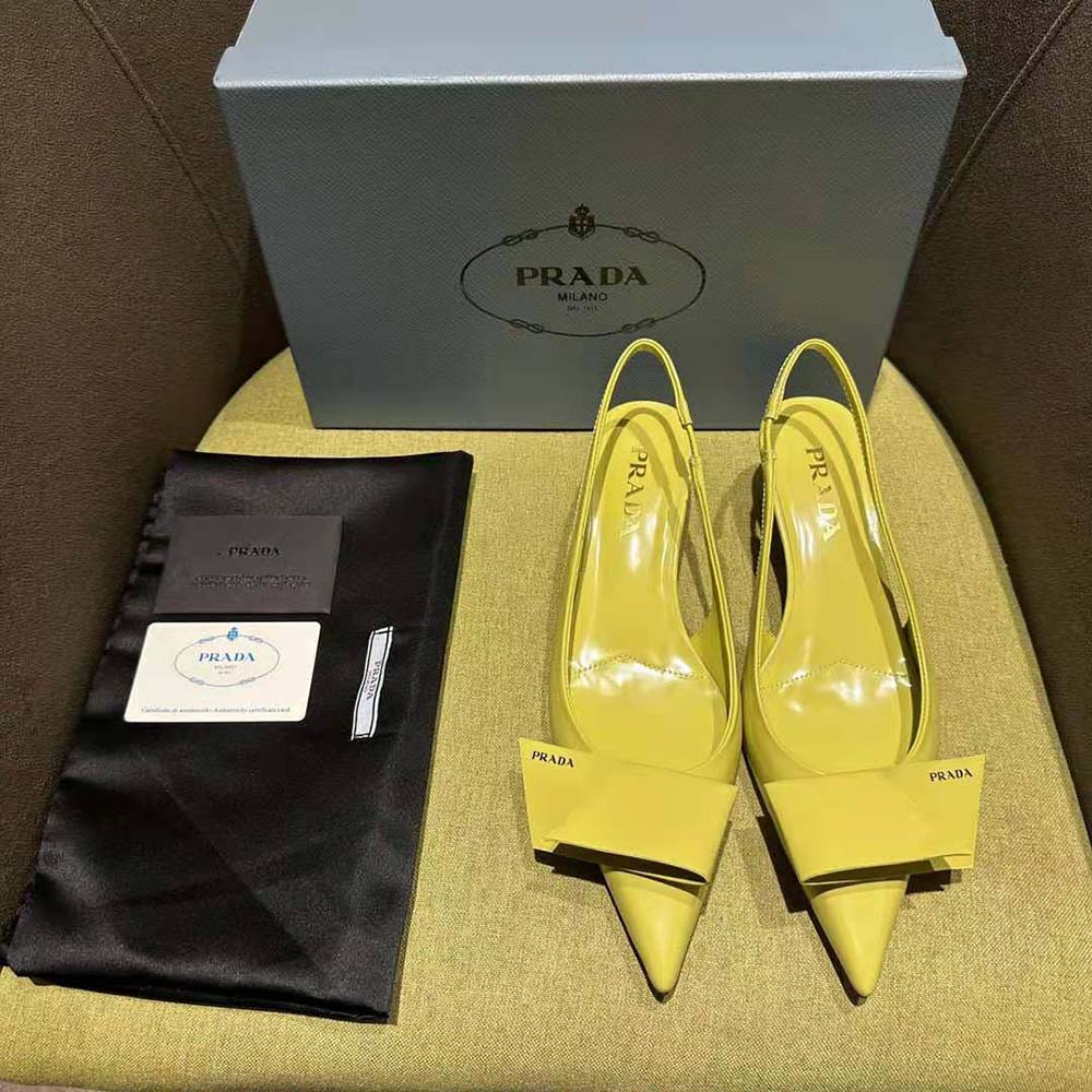 Close-up of gold-tone hardware on Prada Women Brushed Leather Slingback Pumps-Yellow