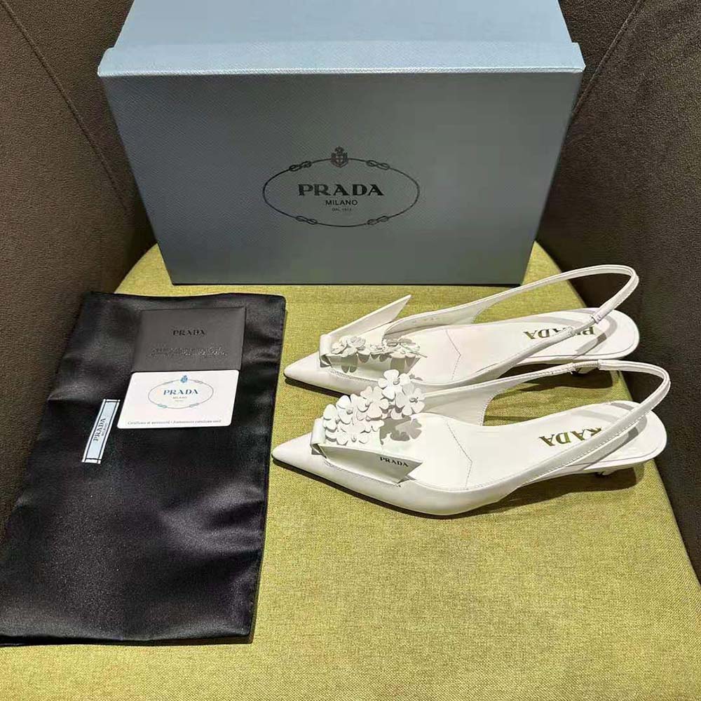 Close-up of floral applique detail on Prada Women Brushed Leather Slingback Pumps-White