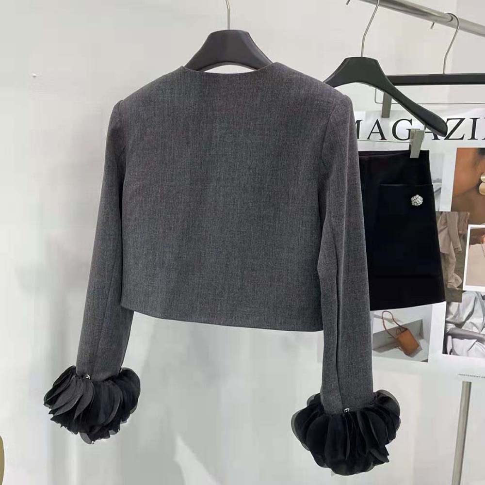 Side profile showing tailored silhouette of Prada Women Wool Jacket Gray
