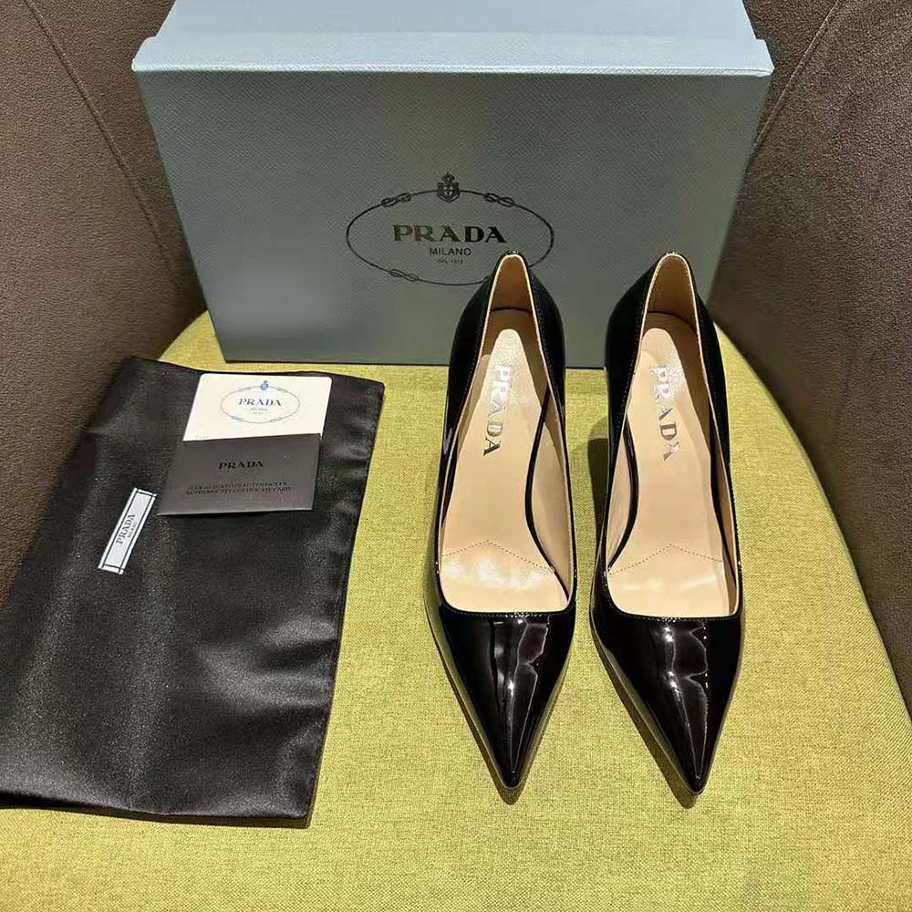 Close-up on glossy patent leather and embossed Prada logo detail