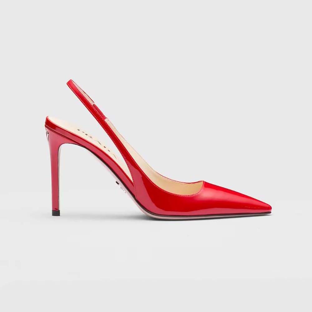 Side angle of Prada Women Patent Leather Slingbacks-Red showing heel detail