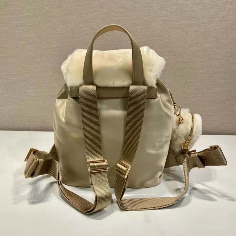 Side profile showing straps and hardware of Prada Women Re-Nylon Backpack