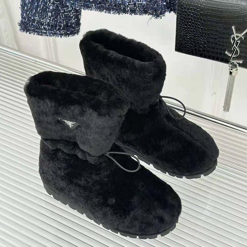 Overhead view of plush shearling texture on Prada Women Shearling Booties Black