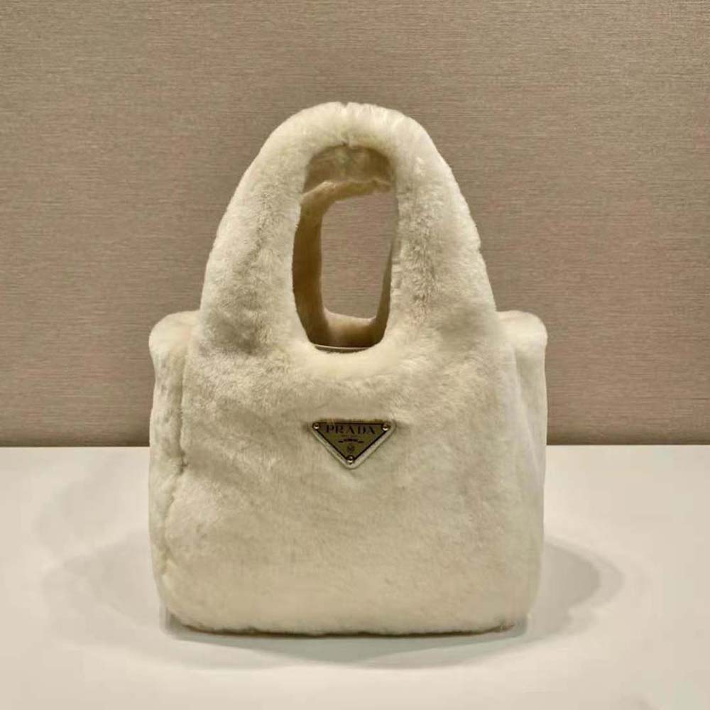 Close-up of plush shearling and leather trim on Prada handbag