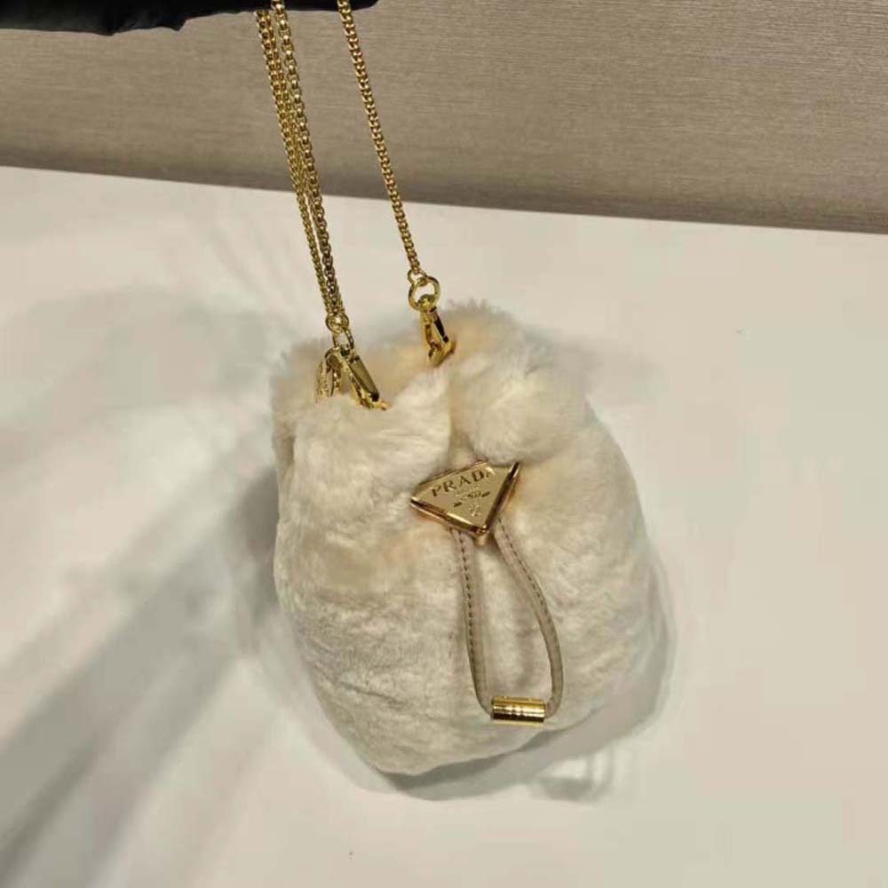 Side profile showing compact silhouette of Prada Women Shearling Mini-pouch-Beige