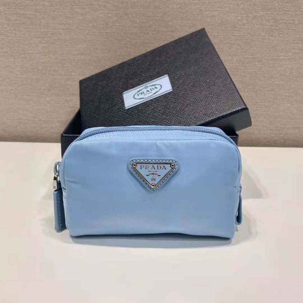 Close-up of textured Re-Nylon fabric and silver hardware on Prada wallet