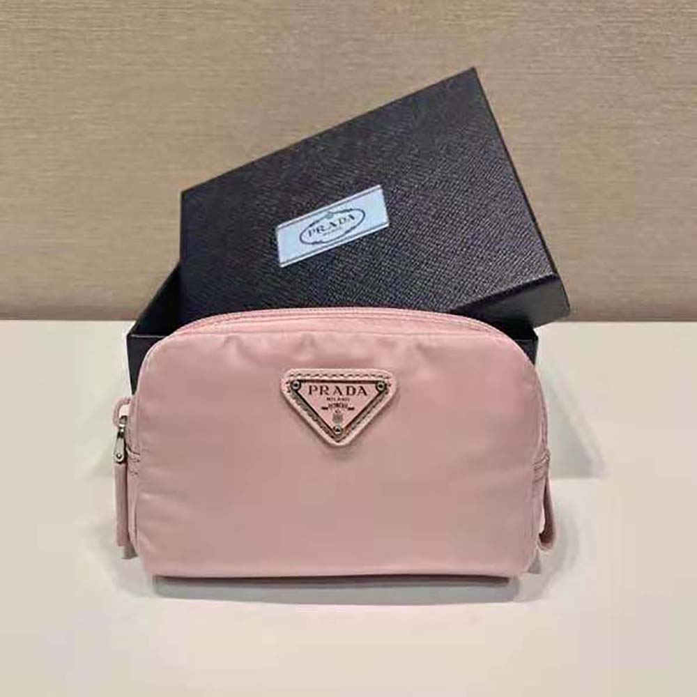 Close-up of pink nylon and silver-tone logo on Prada wallet