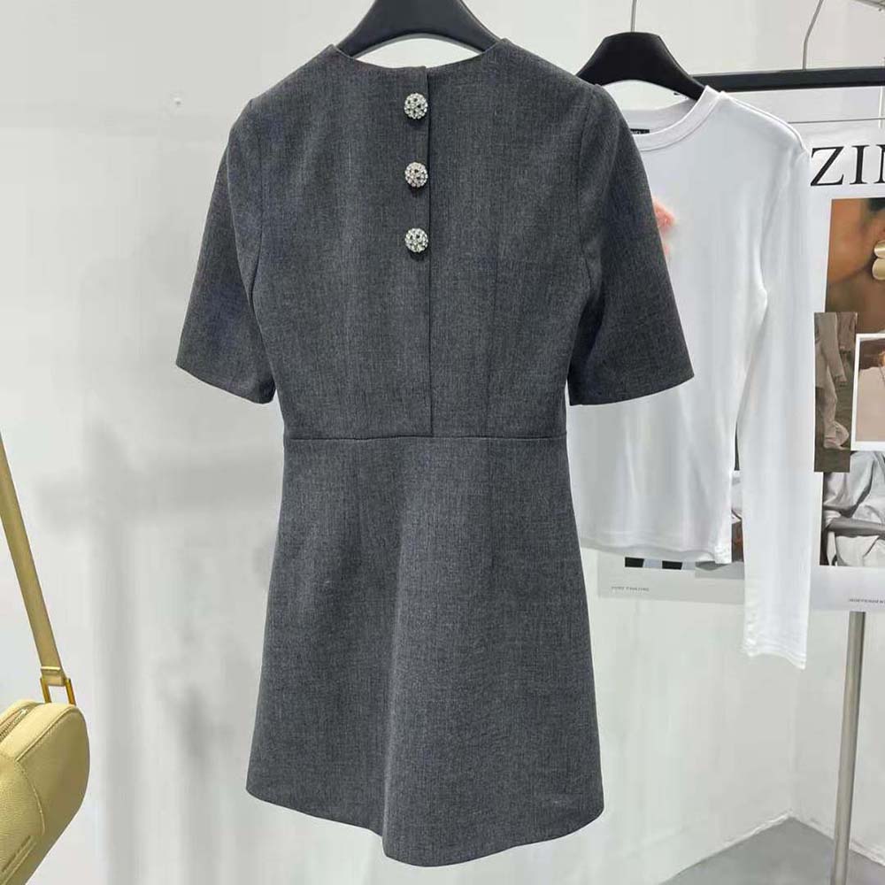 Side angle showing zip closure and texture of Prada mini-dress