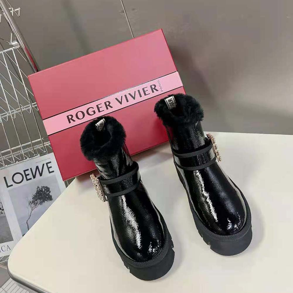 Close-up on sparkling strass buckle of Roger Vivier Winter Fur Ankle Boots