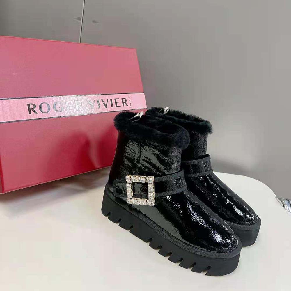Rear angle showing fur lining and sleek silhouette of Roger Vivier black patent boots