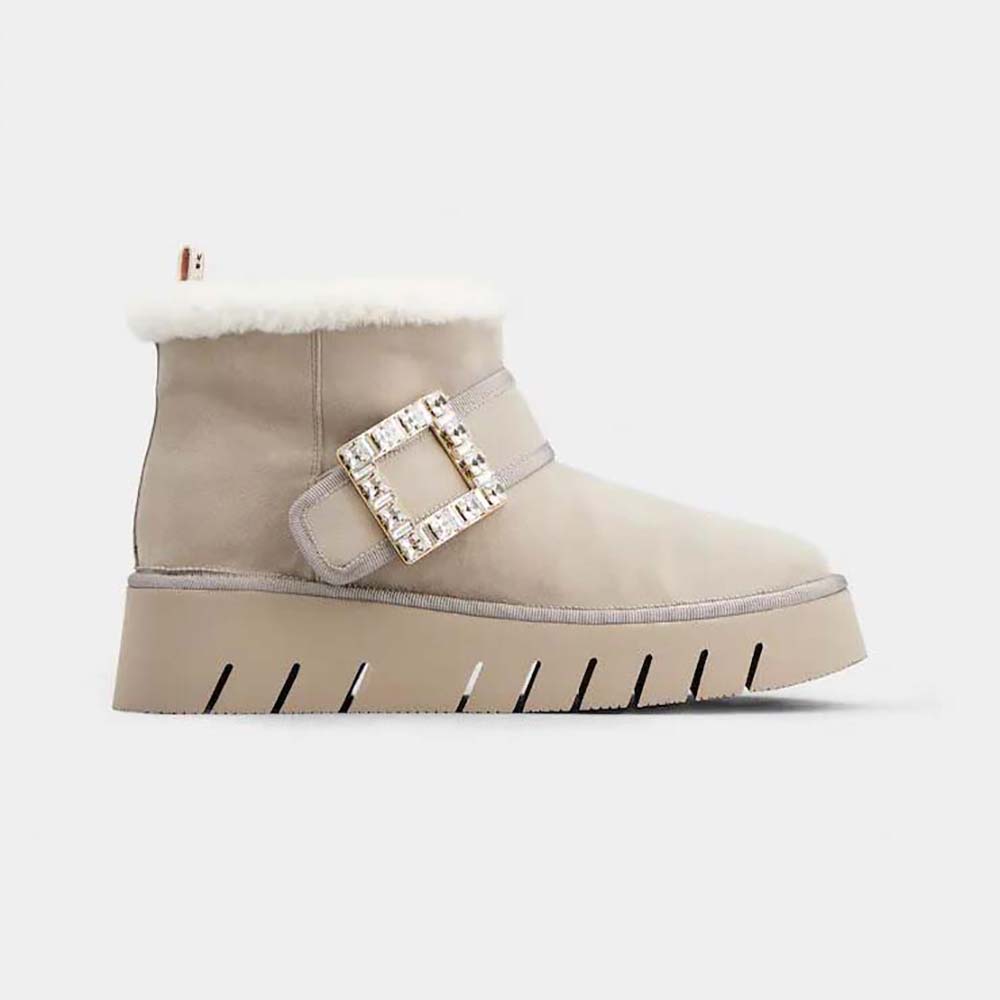 Side profile of Roger Vivier Women Viv’ Winter Fur Strass Buckle Ankle Boots in Suede-Beige