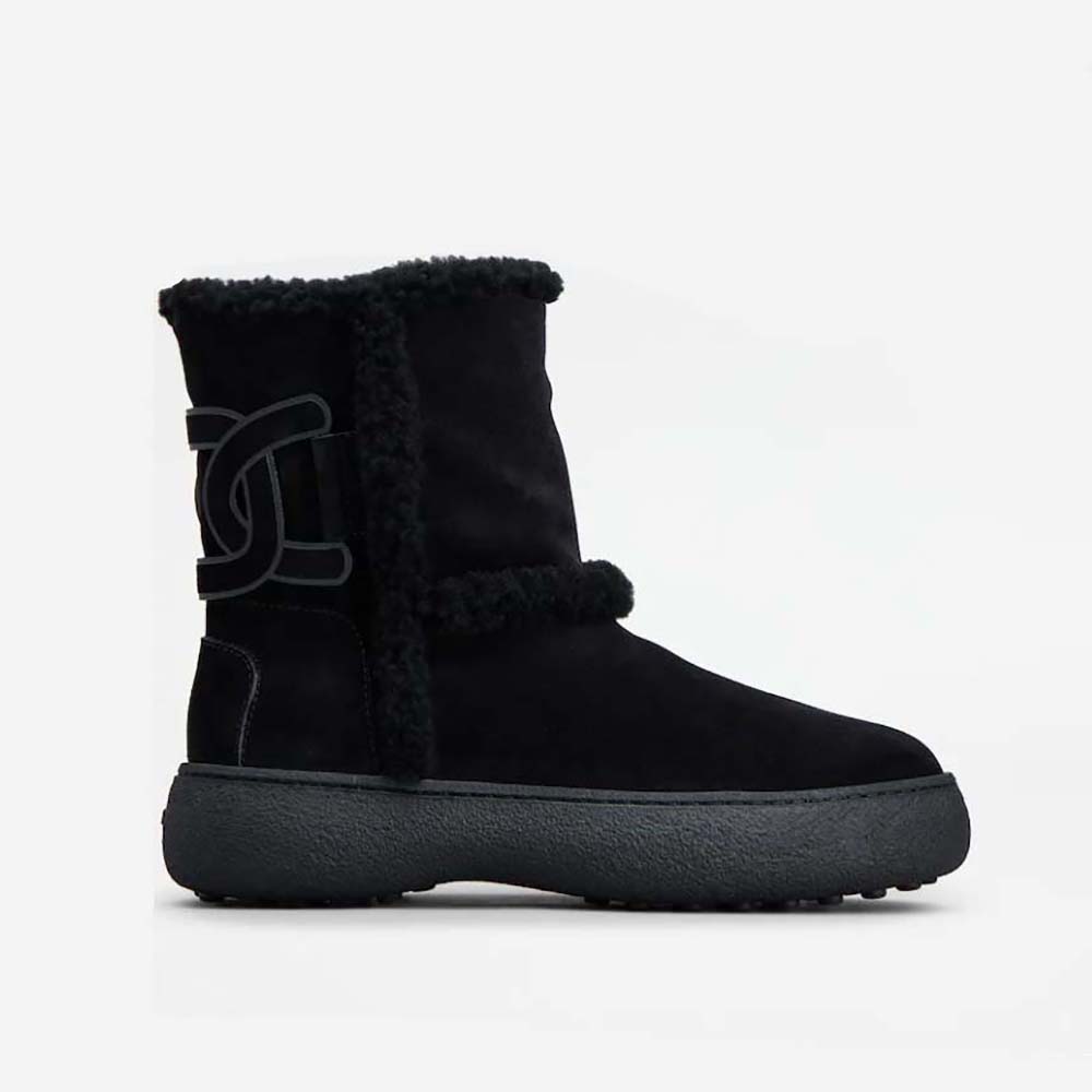 Side view of TODS Unisex Tod’s W. G. Ankle Boots in black suede
