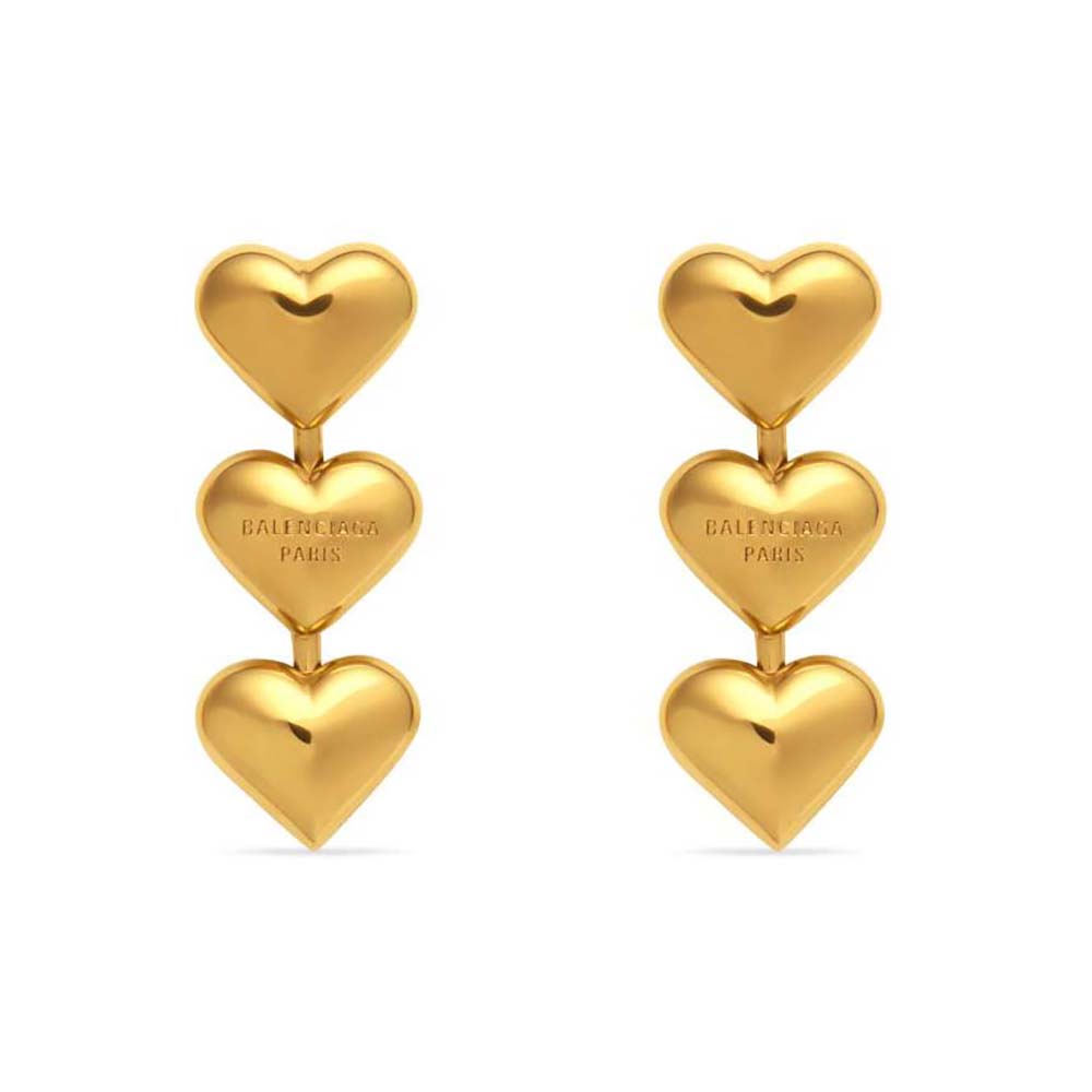 Close-up of Balenciaga Women Heart Earrings in polished gold brass