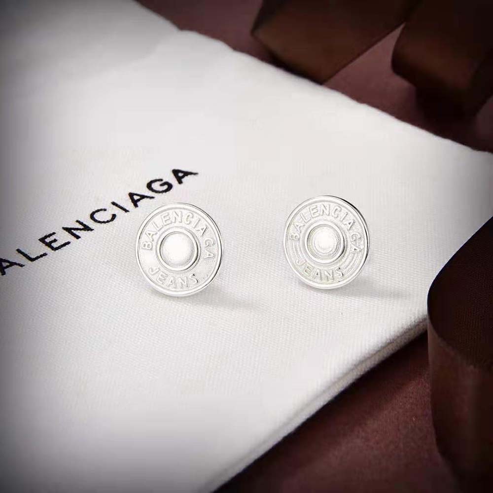 Close-up on Balenciaga logo detail of Jeans Earrings in Light Silver