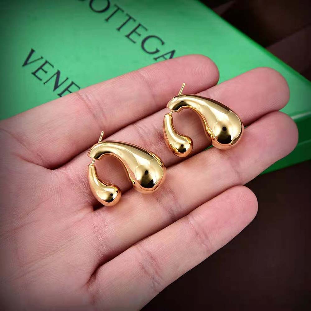 Side angle showing length and gold finish of Bottega Veneta Women Drop Earrings