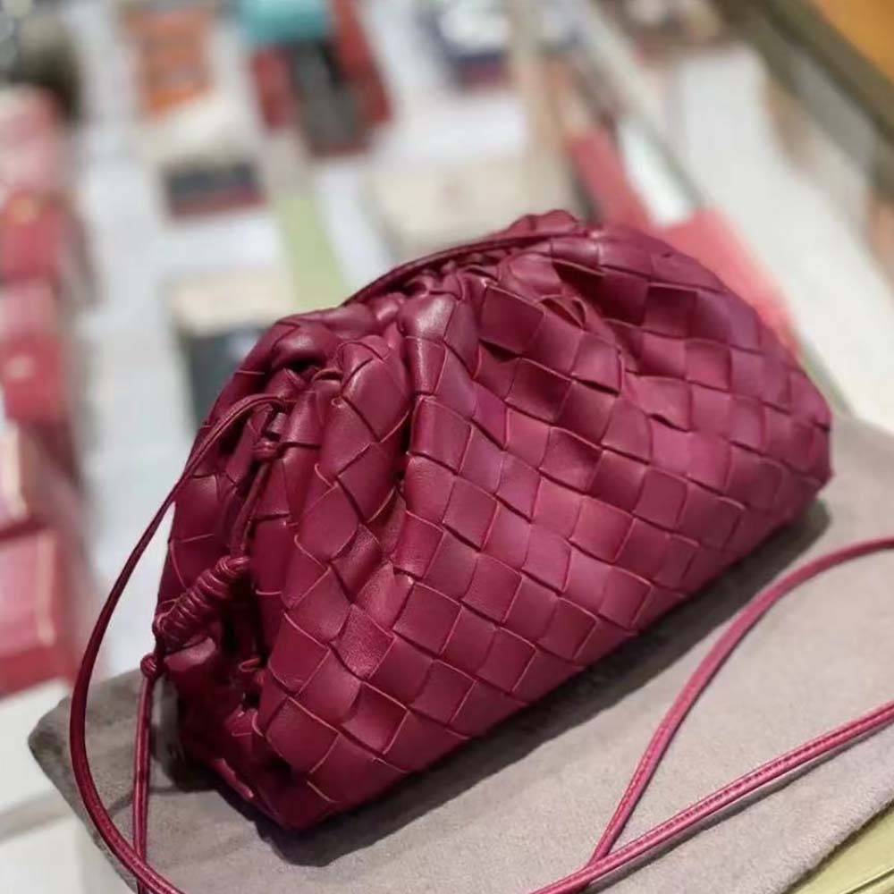 Close-up of supple calf leather texture on Bottega Veneta purple mini pouch