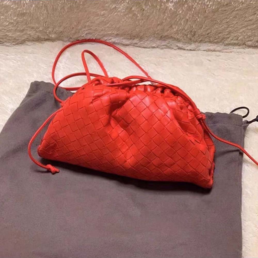 Close-up on the signature knot detail of the Bottega Veneta Mini Pouch clutch
