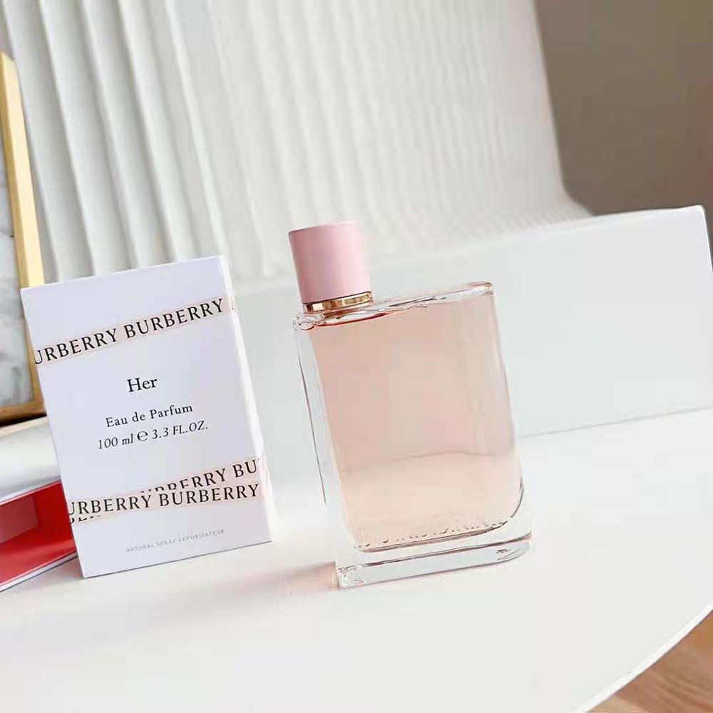 Close-up detail of Burberry logo on cap of perfume bottle