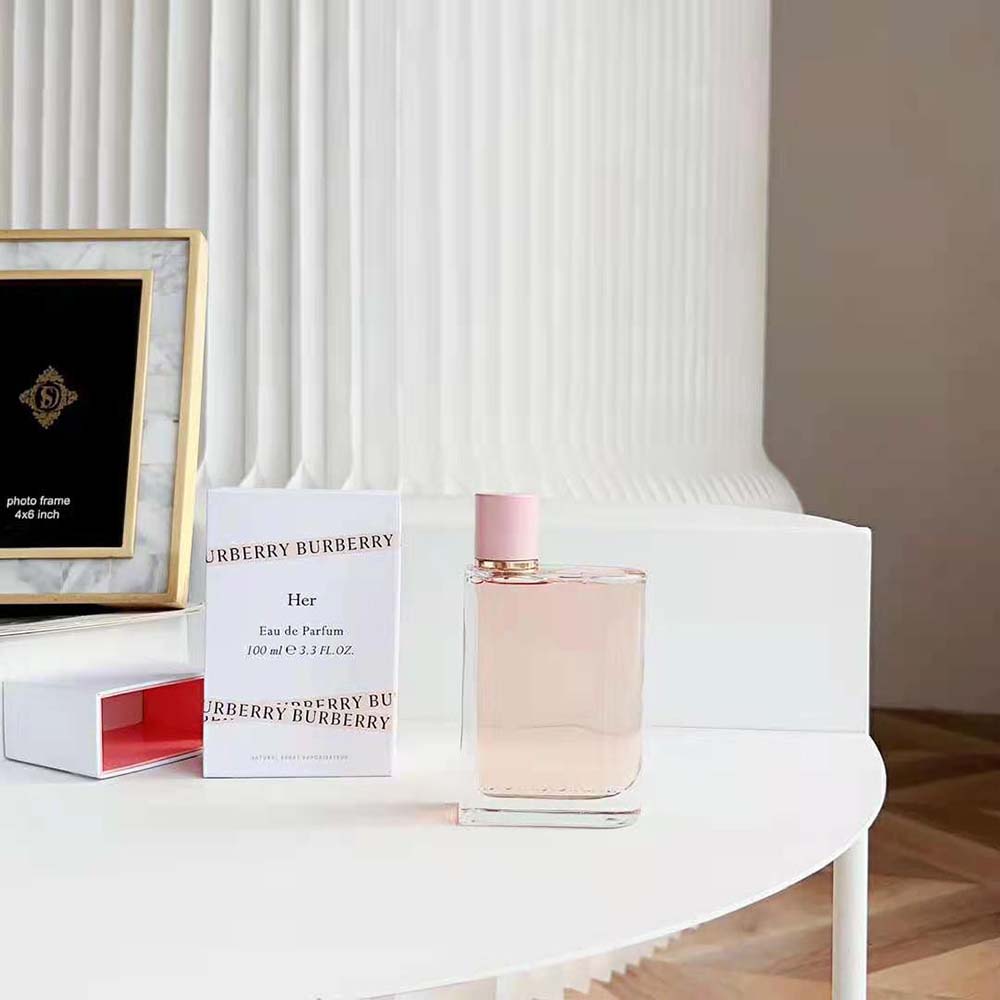 Side angle of Burberry Women Her Eau de Parfum showcasing pink liquid