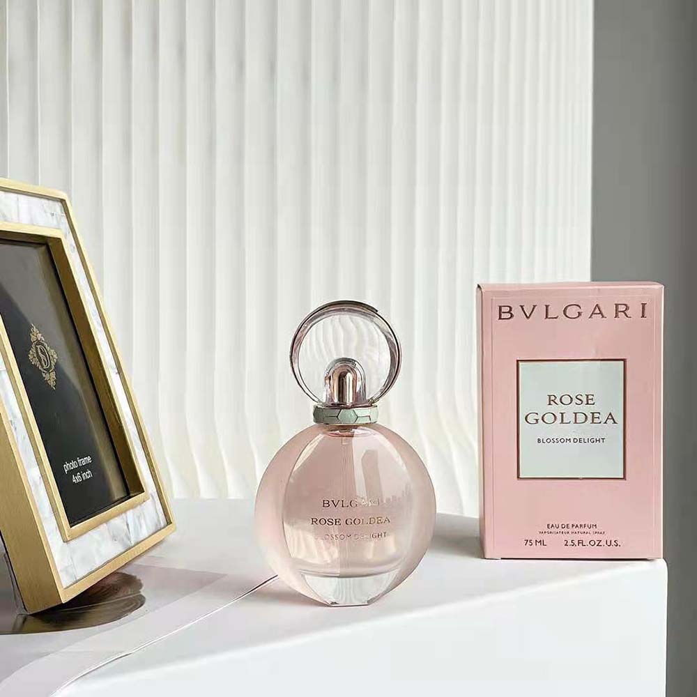 Close-up of pink glass and gold embossed cap on Bvlgari perfume
