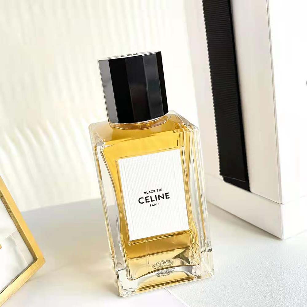 Close-up of gold embossed logo on Celine Unisex Black Tie Eau de Parfum