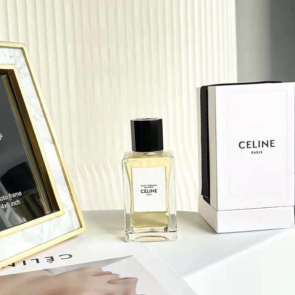 Close-up detail of gold cap and minimalist logo on Celine perfume